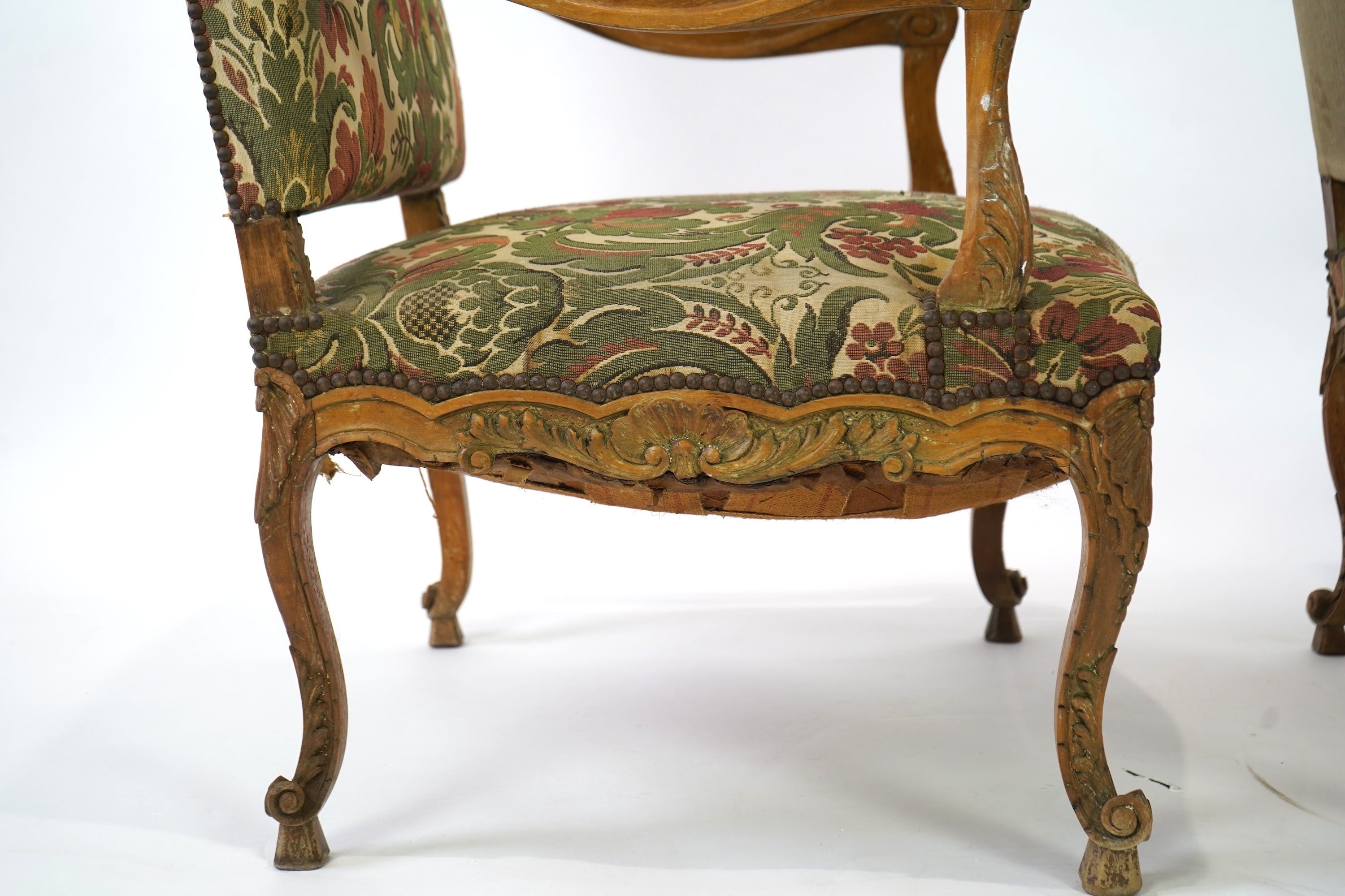 A pair of 19th century Louis XV style carved walnut grand fauteuil